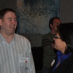 Co-founder of Innovative Baltimore, Benjamin Walsh (left) chat with an attendee at the networking party.