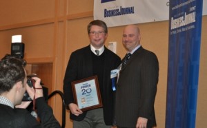 L-R: David Troy (founder of Roundhouse Technologies) receives his award from John Dinkel (Publisher, Baltimore Business Journal)